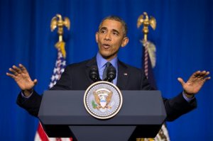 U.S. President Barack Obama speaks during a news conference at the Organization for Economic Cooperation and Development Centre, in Paris, on Tuesday, Dec. 1, 2015. Obama discussed the COP21 climate change summit, and the threat of terrorism from the Islamic State Group. (AP Photo/Evan Vucci)