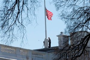 Workers lower the American flag above the White House in Washington, Thursday, Dec. 3, 2015. President Barack Obama ordered that flags be lowered at all government buildings to honor the victims of yesterday's mass shooting in San Bernardino, Calif. (AP Photo/Pablo Martinez Monsivais)