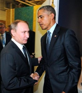 Russian President Vladimir Putin, left, and U.S. President Barack Obama shake hands at the COP21 UN Conference on Climate Change in Paris, France, Monday, Nov. 30, 2015. (Mikhail Klimentyev/Sputnik, Kremlin Pool Photo via AP)
