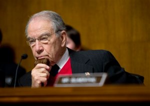Senate Judiciary Committee Chairman Sen. Chuck Grassley, R-Iowa holds the gavel close while listening to testimony by Puerto Rico Gov. Alejandro Javier Garcia Padilla  on Puerto Rico's fiscal problems, Tuesday, Dec. 1, 2015, on Capitol Hill in Washington. Puerto Rico and its debt crisis takes center stage in Congress as its governor testifies before a Senate panel about the U.S. commonwealth's financial woes and the demands of creditors.(AP Photo/Pablo Martinez Monsivais)