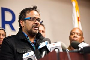 Farhan Khan, brother-in-law of one of the suspects involved in a shooting in San Bernardino, Calif., speaks during a news conference at the Greater Los Angeles Area office of the Council on American-Islamic Relations, in Anaheim, Calif. Multiple attackers opened fire on a banquet at a social services center for the disabled in San Bernardino on Wednesday, killing multiple people and sending police on a manhunt for suspects. (Matt Masin/The Orange County Register via AP) MAGS OUT; LOS ANGELES TIMES OUT; MANDATORY CREDIT