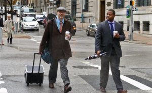 Baltimore City police officer William Porter, right, one of six Baltimore police officers charged with the death of Freddie Gray, walks to courthouse East with one of his attorneys on Wednesday, Dec. 2, 2015 in Baltimore.  Porter faces charges of involuntary manslaughter, second-degree assault, misconduct in office and reckless endangerment. The charges carry maximum prison terms totaling about 25 years. (Kevin Richardson/The Baltimore Sun via AP)  WASHINGTON EXAMINER OUT; MANDATORY CREDIT
