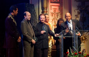 FILE - In this Nov. 8, 2001 file photo, members of "Sly and the Family Stone," Larry Graham, from left, Greg Errico, Jerry Martini, Cynthia Robinson, and Sly Stone's sister and brother, Rosie and Freddie Stewart, accept a Pioneer Award at the Apollo Theatre, in New York. Robinson, a trumpeter and vocalist for Sly and the Family Stone, has died at age 71. Her death was confirmed by Jerry Martini, her longtime friend and fellow horn player in the band. He says he was among those with her when she died of cancer Nov. 23, 2015, at her sisters home in Carmichael, Calif. (AP Photo/Louis Lanzano, File)