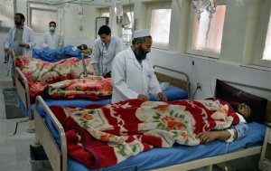 Doctors assist wounded in a hospital after they were injured in a suicide attack, inside a resident house, in Jalalabad, capital of Nangarhar province, Afghanistan, Sunday, Jan. 17, 2016. Several people were killed and others wounded in a suicide attack at the home of a prominent politician in the increasingly volatile eastern city of Jalalabad, an Afghan official said on Sunday.  (AP Photos/Mohammad Anwar Danishyar)