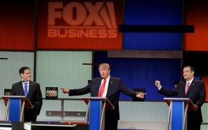 Republican presidential candidate, Sen. Ted Cruz, R-Texas, speaks as Republican presidential candidate, Sen. Marco Rubio, R-Fla., left, and Republican presidential candidate, businessman Donald Trump gestures during the Fox Business Network Republican presidential debate at the North Charleston Coliseum, Thursday, Jan. 14, 2016, in North Charleston, S.C. (AP Photo/Chuck Burton)