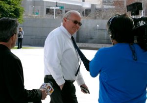 Hildale, Utah mayor Phillip Barlow, center, arrives at the Sandra Day O'Connor United States District Court where a federal civil rights trial against the polygamous towns of Hildale and Colorado City, Ariz., which are located on the Arizona-Utah border, is set to begin, Tuesday, Jan. 19, 2016, in Phoenix. (AP Photo/Ralph Freso)