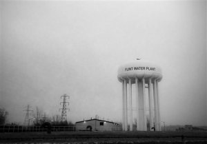 This Jan. 21, 2016 photo shows the water tower at the Flint, Mich., water plant. Flints mayor has floated a shockingly high price to fix the citys lead-contamination problem, saying it could millions to replace damaged pipes. (Perry Rech/American Red Cross via AP) MANDATORY CREDIT