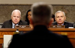 Senate Armed Services Committee Chairman Sen. John McCain, R-Ariz., left, and the committee's rankings member Sen. Jack Reed, D-R.I., question Army Lt. Gen. John Nicholson Jr., center, on Capitol Hill in Washington, Thursday, Jan. 28, 2016, during the committee's hearing on Nicholson's nomination to become the next top American commander in Afghanistan. (AP Photo/Alex Brandon)