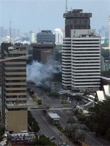 Smoke billows from an explosion in Jakarta, Indonesia, Thursday, Jan. 14, 2016. Suicide bombers exploded themselves in downtown Jakarta on Thursday while gunmen attacked a police post nearby, a witness told The Associated Press. Local television reported more explosions in other parts of the city. (Christian Hubel via AP) MANDATORY CREDIT