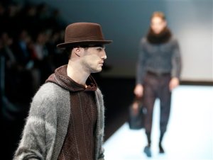 A model wears a creation for Giorgio Armani men's Fall-Winter 2016-2017 collection, part of the Milan Fashion Week, unveiled in Milan, Italy, Tuesday, Jan. 19, 2016. (AP Photo/Antonio Calanni)