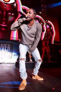 FILE - In this Dec. 4, 2015, file photo, Kendrick Lamar performs at Power 106's Cali Christmas 2015 in Inglewood, Calif. The Recording Academy announced Wednesday, Jan. 20, 2016, that leading nominee Kendrick Lamar will perform at the Grammy Awards on Feb. 15. (Photo by John Salangsang/Invision/AP, File)