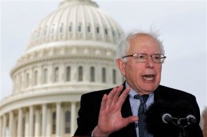 FILE - In this May 10, 2011, file photo Sen. Bernie Sanders, I-Vt., gestures during a news conference on Capitol Hill in Washington to discuss single-payer health care bills in the Senate and House. In In 2016 Democratic presidential candidate Sanders says his plan for a government-run health care system from cradle to grave is like Medicare for all. But with full coverage for long-term care, most dental care included, no deductibles and zero copays, the Sanders plan is considerably more generous. Think of it as Medicare on growth hormones. (AP Photo/Alex Brandon, File)