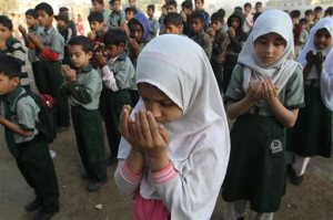 Pakistani students pray for the victims of the Bacha Khan University, at a local school in Karachi, Pakistan, Thursday, Jan. 21, 2016. Pakistan observed a day of mourning Thursday after a deadly attack by Islamic militants who stormed a northwestern university the day before, gunning down students and teachers and spreading terror before the four gunmen were slain by the military. (AP Photo/Fareed Khan)