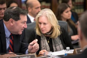 Senate Agriculture Committee members Sen. Joe Donnelly, D-Ind., left, and Sen. Kirsten Gillibrand, D-N.Y., confer on Capitol Hill in Washington, Wednesday, Jan. 20, 2016, as the committee met to approve new measures to set fat, sugar and sodium limits in school lunches. (AP Photo/J. Scott Applewhite)