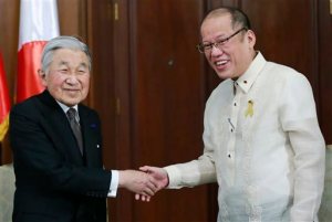 Philippines President Benigno Aquino III, right, greets visiting Japanese Emperor Akihito before a start of their meeting inside the presidential palace in Manila, Wednesday, Jan. 27, 2016. (Romeo Ranoco/Pool Photo via AP)