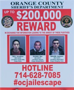 A wanted sign is displayed for the The reward for information leading to the arrest of the  the three escaped inmates from the Orange County Central Men's Jail on Tuesday, Jan. 26, 2016, in Santa Ana, Calif.  Hossein Nayeri, Jonathan Tieu and Bac Duong are believed to be dangerous and all were awaiting trial for separate violent felonies, authorities said. (Paul Rodriguez/The Orange County Register via AP)   MAGS OUT; LOS ANGELES TIMES OUT; MANDATORY CREDIT