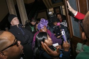 Protesters from Flint, Mich., and Detroit chant, asking for the resignation of Gov. Rick Snyder in relation to Flint's water crisis, at the Capitol in Lansing on Thursday, Jan. 14, 2016. (Sean Proctor/The Flint Journal-MLive.com via AP) MANDATORY CREDIT