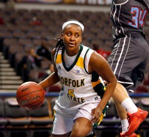FILE - In this March 9, 2015, file photo, Norfolk State's Amber Brown moves the ball againstt Delaware State during a first round game at the Mid-Eastern Athletic Conference NCAA college women's basketball tournament in Norfolk, Va. A week ago, Amber Brown was a junior forward and sometimes starter on the Norfolk State women's basketball team. Now, she's laying in a hospital bed fighting for her life. (The' N. Pham /The Virginian-Pilot via AP, File)