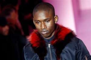 A model wears a creation by Italian designer Riccardo Tisci as part of Givenchy men's Fall-Winter 2016/2017 fashion collection presented in Paris, France, Friday, Jan. 22, 2016. (AP Photo/Francois Mori)