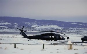 Law enforcement personnel work at the airport Wednesday, Jan. 27, 2016, in Burns, Ore. Authorities were restricting access on Wednesday to the Malheur National Wildlife Refuge being occupied by an armed group after one of the occupiers was killed during a traffic stop and eight more, including the group's leader Ammon Bundy, were arrested. (Thomas Boyd/The Oregonian via AP) MAGS OUT; TV OUT; NO LOCAL INTERNET; THE MERCURY OUT; WILLAMETTE WEEK OUT; PAMPLIN MEDIA GROUP OUT; MANDATORY CREDIT