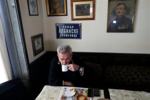 Capt. Vlatko Vodopivec, the pilot who had landed a jetliner in Somalia with a large hole on its fuselage drinks a cup of tea, during an interview with The Associated Press in Belgrade, Serbia, Sunday, Feb. 7, 2016. Vodopivec says he has never doubted it was caused by a bomb and described the security at Mogadishu airport as "zero." (AP Photo/Darko Vojinovic)
