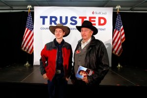 Audience members pose for photographs in front of the stage for Republican presidential candidate, Sen. Ted Cruz, R-Texas, at a campaign event at the Johnson County Fairgrounds, Sunday, Jan. 31, 2016 in Iowa City, Iowa. (AP Photo/Paul Sancya)