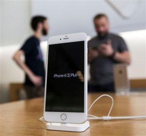An Apple iPhone 6s Plus smartphone is displayed Friday, Sept. 25, 2015 at the Apple store at The Grove in Los Angeles.  On Wednesday, Feb. 17, 2016, a federal judge ordered Apple Inc. to help the FBI hack into an encrypted iPhone used by Syed Farook, who along with his wife, Tashfeen Malik, killed 14 people in December in the worst terror attack on U.S. soil since Sept. 11, 2001.  Apple has helped the government before in this and previous cases, but this time Apple CEO Tim Cook said no and Apple is appealing the order. (AP Photo/Ringo H.W. Chiu)