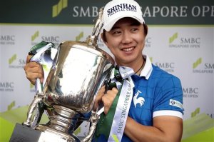 Song Younghan poses with his trophy after winning the SMBC Singapore Open golf tournament at Sentosa Golf Club's Serapong Course on Monday, Feb. 1, 2016, in Singapore. (AP Photo/Wong Maye-E)