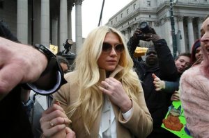Pop star Kesha leaves Supreme court in New York, Friday, Feb. 19, 2016. Kesha is fighting to wrest her career away from a hitmaker she says drugged, sexually abused and psychologically tormented her _ and still has exclusive rights to make records with her. Producer Dr. Luke says the singer is slinging falsehoods and ruining his reputation to try to weasel out of her recording contract and strike a new deal.  (AP Photo/Mary Altaffer)