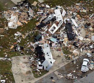 This aerial photo shows damage after a tornado ripped through the Sugar Hill Recreational Park in the town of Convent, in southern La., Wednesday, Feb. 24, 2016. Tornadoes ripped through the RV park in Louisiana and significantly damaged nearly 100 homes and apartments in Florida as a deadly storm system rolled across the South, and forecasters warned that more twisters were possible Wednesday along the East Coast.  (David Grunfeld /NOLA.com The Times-Picayune via AP) MAGS OUT; NO SALES; USA TODAY OUT; THE BATON ROUGE ADVOCATE OUT; THE NEW ORLEANS ADVOCATE OUT; MANDATORY CREDIT /NOLA.com The Times-Picayune via AP) MAGS OUT; NO SALES; USA TODAY OUT; THE BATON ROUGE ADVOCATE OUT; THE NEW ORLEANS ADVOCATE OUT; MANDATORY CREDIT
