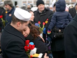 U.S. Navy Petty Officer 3rd Class Izaak Vaszquez and his wife Andrea embrace on the pier when the navy attack submarine USS Missouri (SSN 780) returns to the Navy Submarine Bast in Groton, Conn., Friday, Feb. 12, 2016 following a six-month deployment to the European Command area of responsibility. The Missouri, the seventh sub in the Virginia-class, made port calls in Faslane, Scotland, Rota, Spain and Brest, France during the deployment. (Sean D. Elliot/The Day via AP) MANDATORY CREDIT