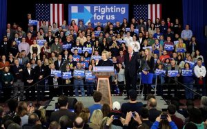 Democratic presidential candidate Hillary Clinton speaks as former President Bill Clinton and Chelsea Clinton listen at her New Hampshire presidential primary campaign rally, Tuesday, Feb. 9, 2016, in Hooksett, N.H. Clinton lost to Bernie Sanders in New Hampshire.  (AP Photo/Elise Amendola)