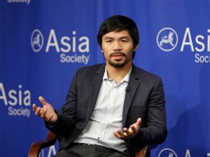 FILE - In this Oct. 12, 2015, file photo, Manny Pacquiao takes questions at the Asia Society in New York. Boxing star Pacquiao has created a firestorm in his home country after saying people in same-sex relationships are worse than animals. Pacquiao, who is running for a Philippine Senate seat, made the remark in a video posted Monday, Feb. 15, 2016, on local TV5s election site. He also said animals are better than people in same-sex relationships because they recognize the difference between males and females. (AP Photo/Seth Wenig, File)