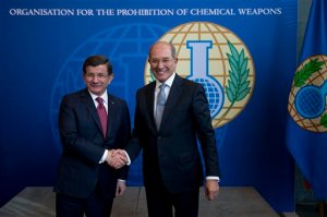 Turkish Prime Minister Ahmet Davutoglu, left, is greeted by Ahmet Uzumcu, director-general of the  Organisation for the Prohibition of Chemical Weapons (OPCW) in The Hague, Netherlands, Wednesday, Feb. 10, 2016. (AP Photo/Peter Dejong)