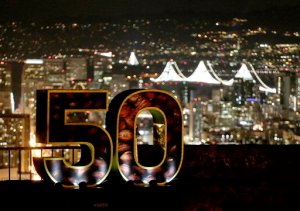 A Super Bowl 50 sign stands in a park overlooking San Francisco Wednesday, Feb. 3, 2016. The Denver Broncos play the Carolina Panthers in the NFL Super Bowl 50 football game Sunday, Feb. 7, 2015, in Santa Clara, Calif. (AP Photo/Charlie Riedel)