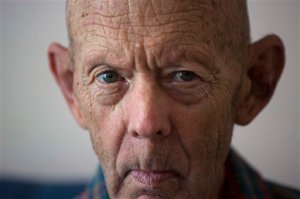 In this Feb. 4, 2016 photo, Otto Macias sits at his home during an interview in Havana, Cuba. Macias fled the Cuban revolution for the U.S. at 19, then spent eight years in Vietnam as a heavy machine-gunner fighting for his new country. The department of Veterans´Affairs cut off his benefits after he was hospitalized in Cuba for a psychological collapse during a 1980 trip to see the family. (AP Photo/Desmond Boylan)
