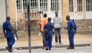 Police arrest a man following grenade attacks in the capital Bujumbura, Burundi Wednesday, Feb. 3, 2016. Burundian police say at least eight people have been wounded in a series of grenade attacks in the center of the capital. (AP Photo)
