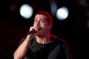 FILE - In this Sept. 20, 2013 file photo, Rob Thomas of Matchbox Twenty performs during the annual Rock in Rio music festival in Rio de Janeiro, Brazil. Matchbox Twenty frontman Thomas has apologized after being accused of making a racist joke during a solo concert in Australia. Thomas apologized on Facebook following the Saturday, Feb. 20, 2016, night show in Melbourne, where he joked about dealing with jetlag by drinking. Thomas said: "And then I drink until I think I'm Australian, and I keep drinking until I think I'm a black Australian." (AP Photo/Silvia Izquierdo, File)