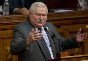 Poland's former president and Solidarity founder Lech Walesa delivers a speech during a special session of Venezuela's National Assembly, in Caracas, Venezuela, Thursday, Feb. 18, 2016. Walesa, the icon of Poland's successful struggle to topple communism and the 1983 Nobel Peace Prize laureate, has previously acknowledged signing a commitment to be an informant, but has insisted he never acted on it. In 2000 he was cleared by a special court, which said it found no evidence of collaboration. (AP Photo/Fernando Llano)