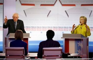 Democratic presidential candidates, Sen. Bernie Sanders, I-Vt, and Hillary Clinton argue a point during a Democratic presidential primary debate at the University of Wisconsin-Milwaukee, Thursday, Feb. 11, 2016, in Milwaukee. (AP Photo/Morry Gash)