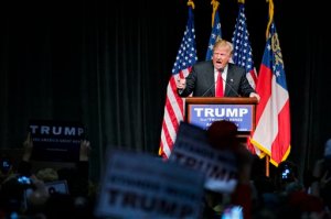 FILE - In this Feb. 21, 2016 file photo, Republican presidential candidate Donald Trump speaks at a campaign event in Atlanta. With its red, white and blue bunting, patriotic slogans and ubiquitous country songs, the presidential campaign marching through South Carolina and Nevada seems like an all-American affair. But it holds familiar overtones to Europeans watching anxiously from abroad. (AP Photo/David Goldman, File)