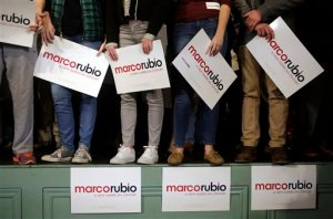 In this Feb. 2, 2016, photo, supporters of Republican presidential candidate, Sen. Marco Rubio, R-Fla., stand on a stage and hold placards before a campaign event in Exeter, N.H. Rubios strong third-place finish in Iowa is sounding like a starting gun to the Republican Partys top donors. Many have been sitting on the sidelines or spreading their money around to multiple presidential candidates. They have been waiting to see whether one of four experienced politicians can take on political newcomer Donald Trump and conservative insurgent Ted Cruz.(AP Photo/Steven Senne)