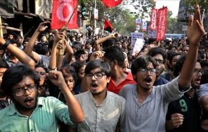 Students, teachers and supporters of left parties protest against the arrest of a student union leader of New Delhi's Jawaharlal Nehru University outside Jadavpur University campus in Kolkata, India, Thursday, Feb. 18, 2016. Scenes of protest that rocked a New Delhi university this week spread across the country Thursday, with students and teachers from cities including Bangalore, Kolkata and Chennai joining demands for the release of a student leader arrested on sedition charges. (AP Photo/Bikas Das)