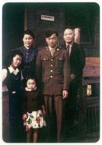 In this 1945 photo provided by Alice Tanaka Hikido, members of the Tanaka family stand together at the Minidoka Japanese internment camp in Jerome, Idaho, where they were held in forced incarceration during World War II. Alice Tanaka Hikido, left, and her sister, Mary Tanaka Abo, who was the child in the foreground, participated in a Feb. 19, 2016, ceremony at Joint Base Elmendorf-Richardson, Alaska, that was held to remember the forced incarceration of more than 200 Alaskans, as well unveil the results of a study about a little-known Japanese internment camp that was erected there during World War II. Also pictured are Nobu Tanaka, back left, John Tanaka, in uniform second from right, standing next to Shonosuke Tanaka. (Alice Tanaka Hikido via AP)