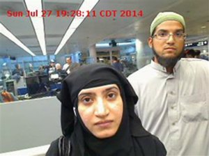 This July 27, 2014, photo provided by U.S. Customs and Border Protection shows Tashfeen Malik, left, and Syed Farook, as they passed through O'Hare International Airport in Chicago. A U.S. magistrate has ordered Apple to help the Obama administration hack into an iPhone belonging to one of the shooters in San Bernardino, Calif. The ruling by Sheri Pym on Feb. 16, 2016, requires Apple to supply highly specialized software the FBI can load onto the phone to cripple a security encryption feature that erases data after too many unsuccessful unlocking attempts. Federal prosecutors told the judge they cant access a county-owned work phone used by Farook because they dont know his passcode.  (U.S. Customs and Border Protection via AP)
