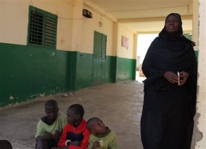 In this photo taken on Friday, Nov. 20, 2015,  teacher  Kannan Thiam at the mosque that was used by Imam Alioune Badara Ndao in Kaolack, Senegal. Dozens of armed security forces descended on the Quranic school at night, arresting an imam suspected of having links to Islamic extremists in Nigeria.(AP Photo/Baba Ahmed)