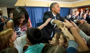 President Barack Obama and first lady Michelle Obama greet children and families of U.S. embassy personnel during an event at the Melia Habana Hotel in Havana, Cuba, Sunday, March 20, 2016. Obama's trip is a crowning moment in his and Cuban President Raul Castro's ambitious effort to restore normal relations between their countries. (AP Photo/Pablo Martinez Monsivais)