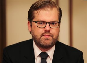 Chris Backemeyer, the Principal Deputy Coordinator for Sanctions Policy at the U.S. Department of State, talks with the journalists about Iran's sanctions in Dubai, United Arab Emirates, Wednesday, March 23, 2016. Two months after the implementation of last years landmark nuclear agreement, the U.S. diplomat is on an unlikely mission _ promoting Iran to firms that want to tap into its massive market but fear other sanctions, or that the next American president could scrap the deal. (AP Photo/Kamran Jebreili)