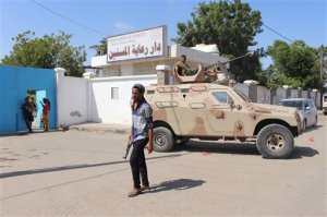 Yemeni security forces gather outside an elderly care home after it was attacked by gunmen in the port city of Aden, Yemen, Friday, March 4, 2016. Unidentified gunmen stormed a retirement home run by Catholic nuns in the southern city of Aden on Friday shooting more than a dozen people to death, including several Indian nuns, Yemeni security officials and witnesses said. (AP Photo/Wael Qubady)