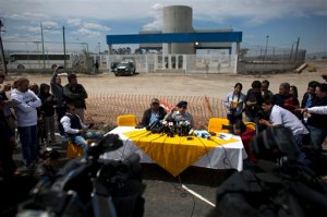 Jose Luis Gonzalez Meza, center, one of Joaquin "El Chapo" Guzmans lawyers, holds a press conference outside the gates of the Altiplano maximum security prison to announce he would begin a hunger strike in protest over the drug lord's treatment inside the prison, near Toluca, Mexico state, Mexico, Friday, March 4, 2016. The once-secretive Mexican drug lord has launched a public relations blitz, calling on his lawyers and even his common-law wife to keep his name in the news. (AP Photo/Rebecca Blackwell)
